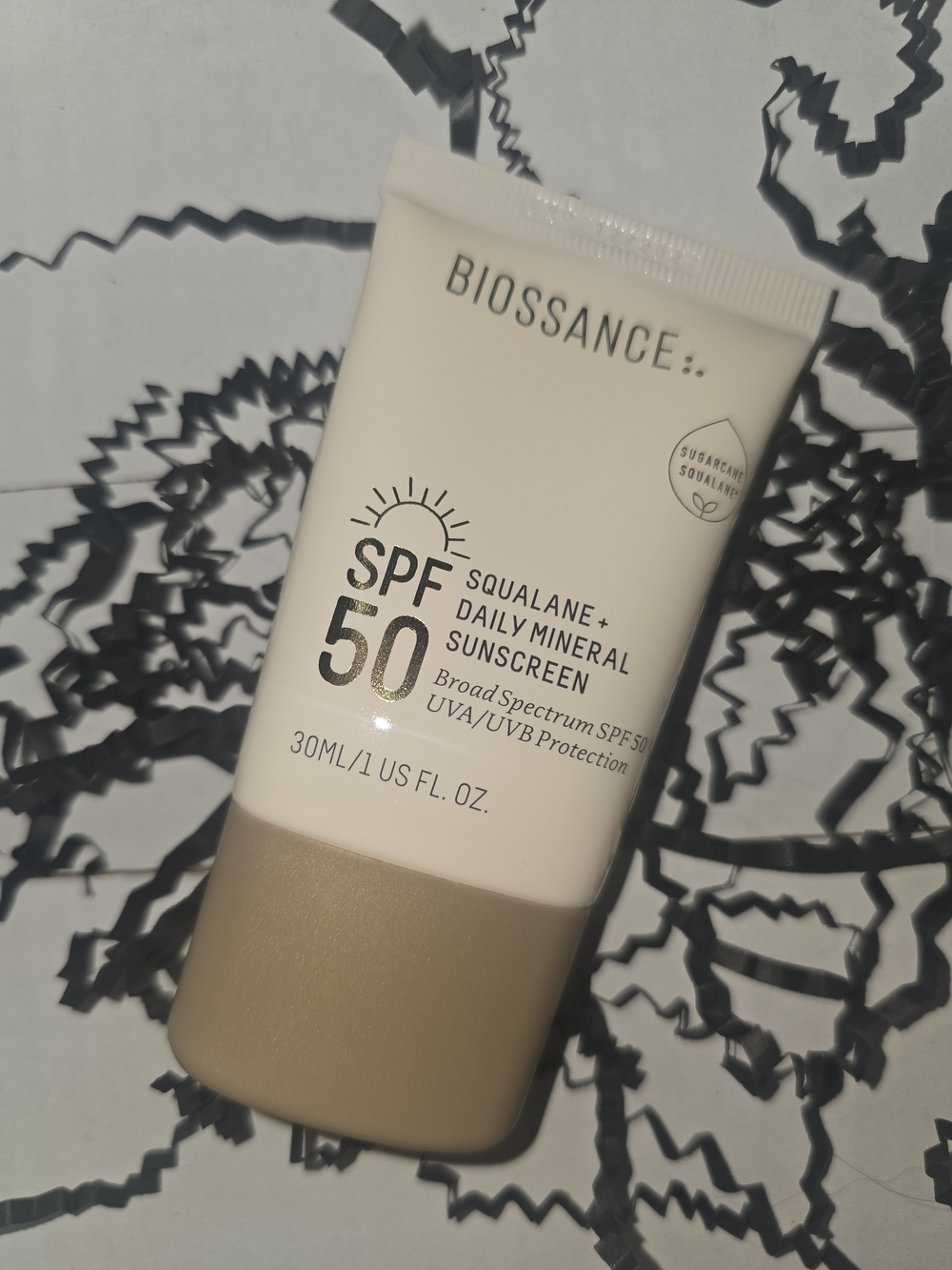 Biossance SPF 50 Daily Mineral Sunscreen — Cream & Tan Tube